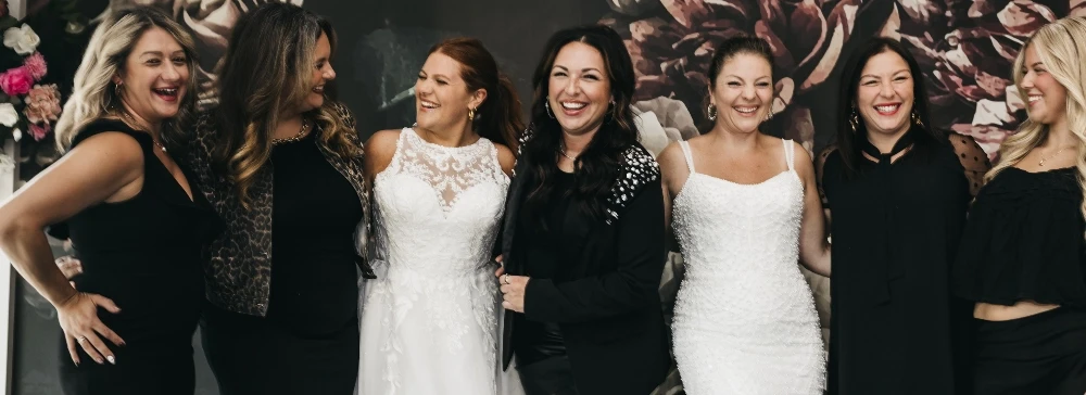 Models wearing a white and black dresses