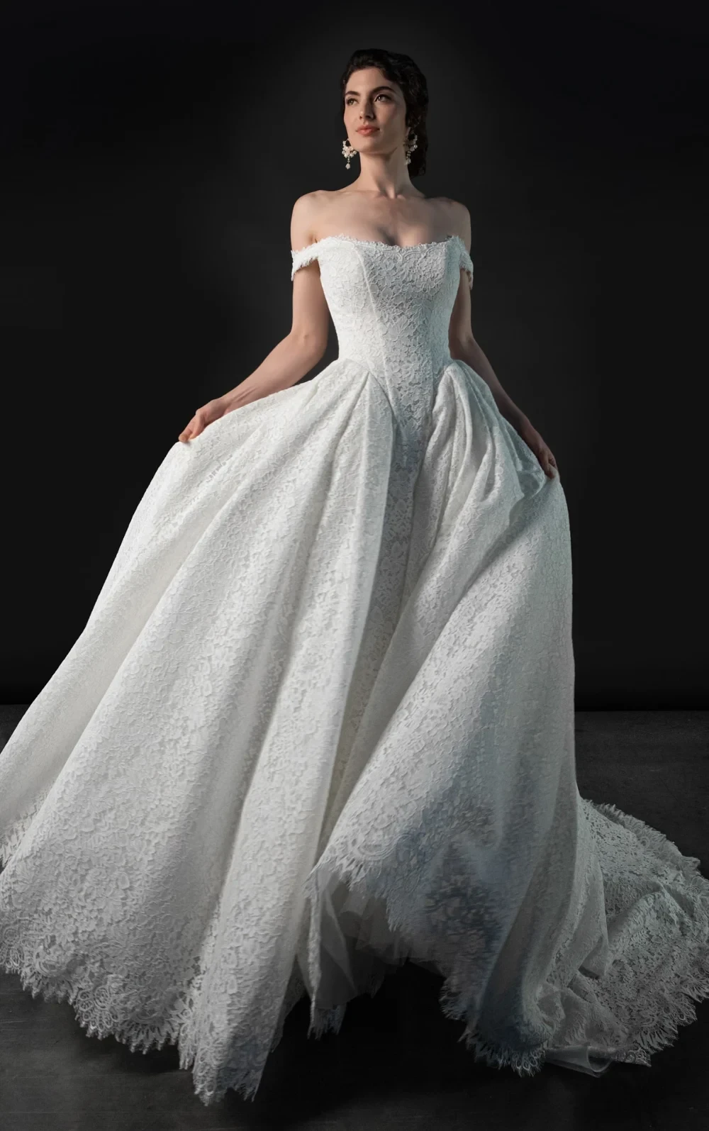 Model wearing a white gown by Martina Liana